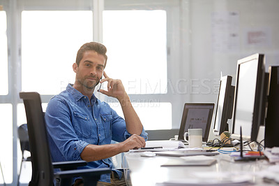 Buy stock photo Shot of a businessman using his cellphone in his office