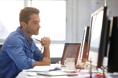 Buy stock photo Cropped shot of a businessman working on his computer