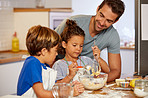 Dad is proud that his kids are baking by themselves