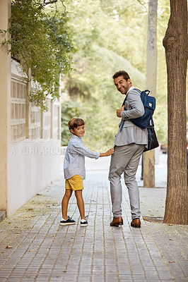 Buy stock photo Shot of a businessman walking his son to school