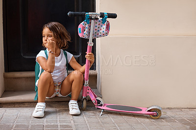 Buy stock photo Shot of a little girl sitting with her scooter