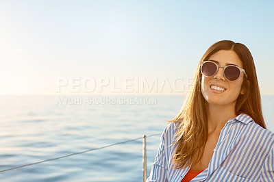 Buy stock photo Shot of a beautiful young woman going for an ocean cruise on a boat