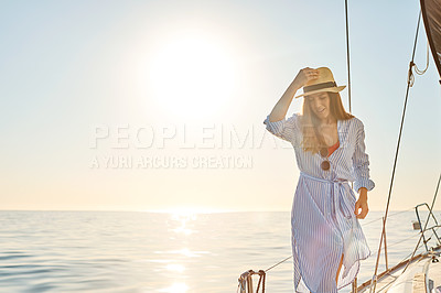 Buy stock photo Shot of a beautiful young woman going for an ocean cruise on a boat