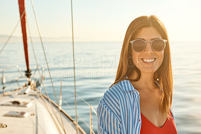 Buy stock photo Shot of a beautiful young woman going for an ocean cruise on a boat
