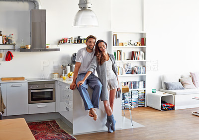 Buy stock photo Shot of a young couple spending time together in the morning at home