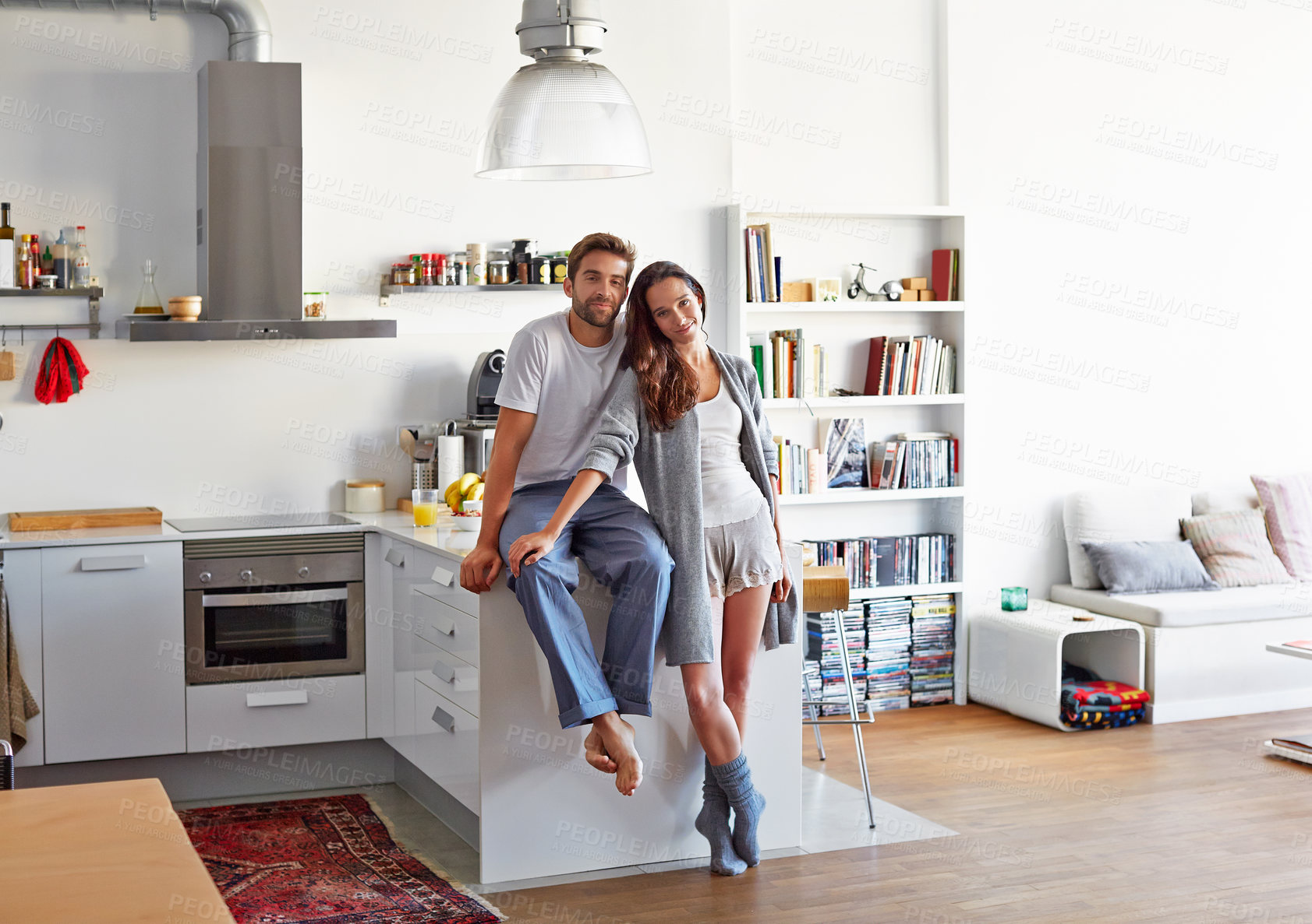 Buy stock photo Shot of a young couple spending time together in the morning at home