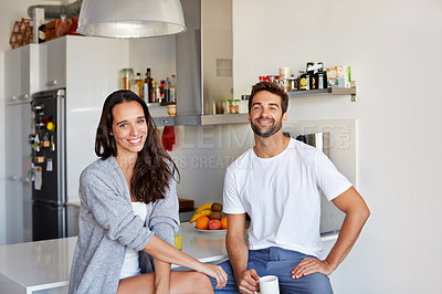 Buy stock photo Shot of a young couple spending time together in the morning at home
