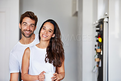 Buy stock photo Shot of a young couple spending time together in the morning at home