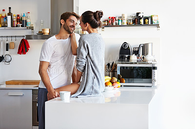 Buy stock photo Shot of an affectionate young couple spending time together in the morning at home