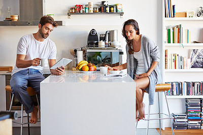 Buy stock photo Shot of a young couple going through their morning routine together at home