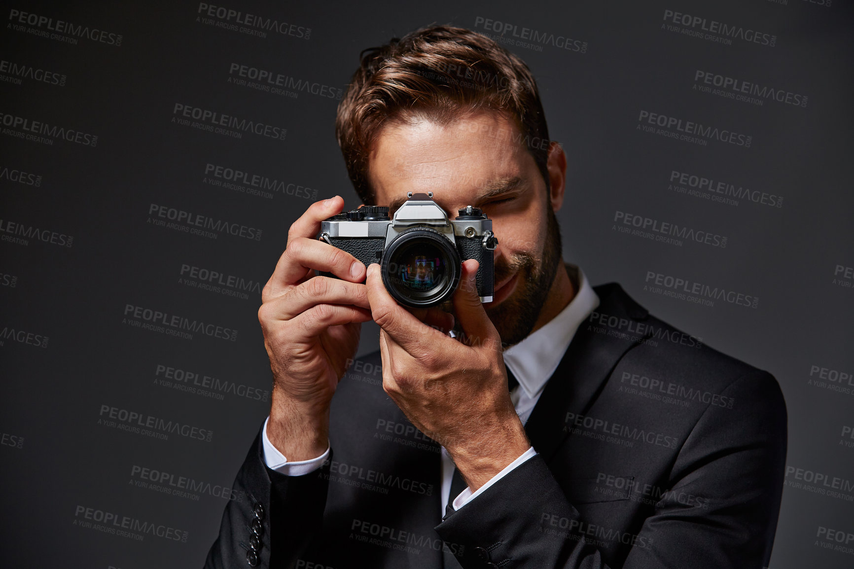 Buy stock photo Camera, photography and portrait of man in studio for event photoshoot pov, lens and artist. Corporate coordinator, media director and film production with person on dark background for equipment