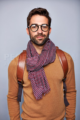 Buy stock photo Studio portrait of a handsome young man posing against a grey background