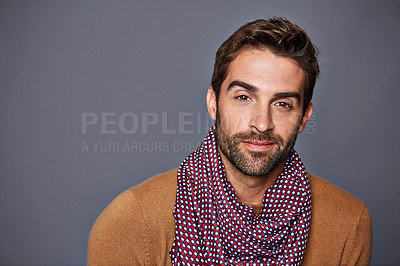 Buy stock photo Studio portrait of a handsome young man posing against a grey background