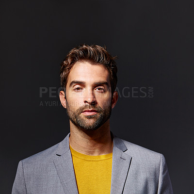 Buy stock photo Studio portrait of a handsome young businessman standing against a grey background