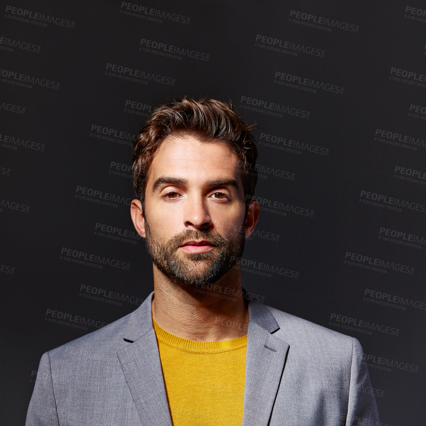 Buy stock photo Studio portrait of a handsome young businessman standing against a grey background
