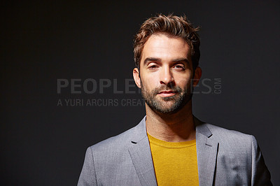 Buy stock photo Studio portrait of a handsome young businessman standing against a grey background