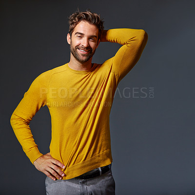 Buy stock photo Studio portrait of a handsome man posing against a grey background