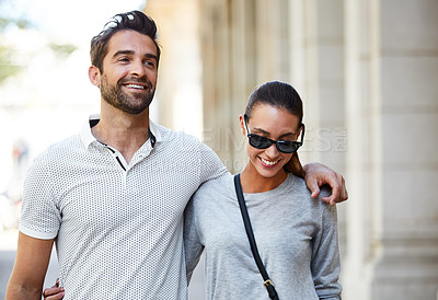 Buy stock photo Shot of an affectionate young couple exploring a foreign city