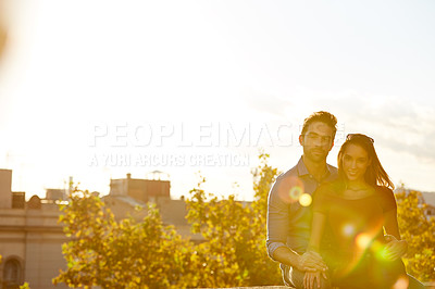 Buy stock photo Shot of a couple out on a rooftop for their date