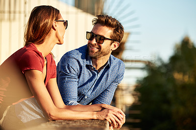 Buy stock photo Shot of an affectionate young couple exploring a foreign city