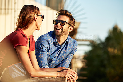 Buy stock photo Shot of an affectionate young couple exploring a foreign city