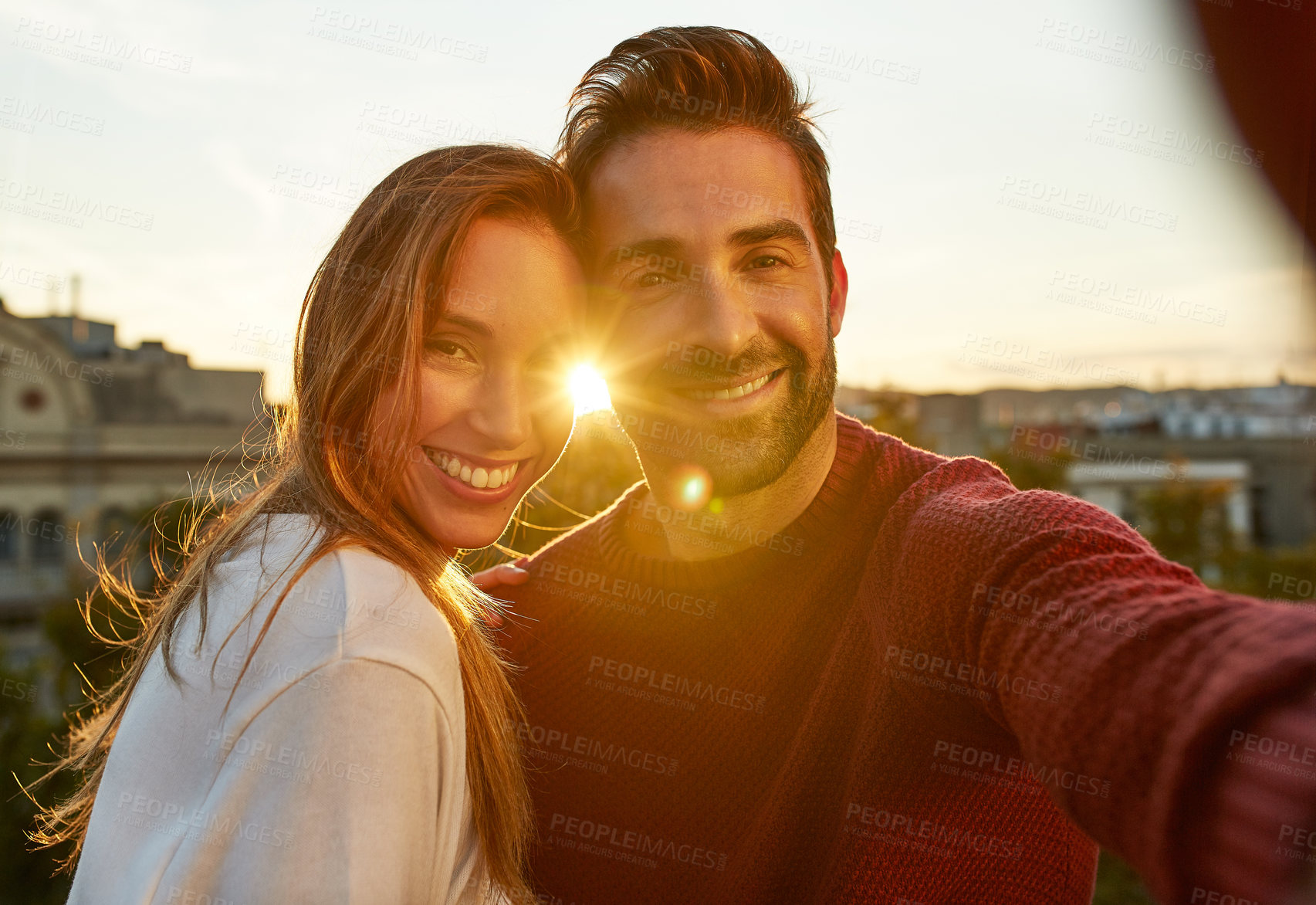Buy stock photo Shot of a couple out on a rooftop for their date