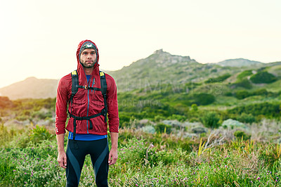 Buy stock photo Cropped shot of a handsome young male athlete out for a morning run