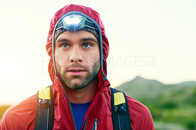 Buy stock photo Cropped shot of a handsome young male athlete out for a morning run