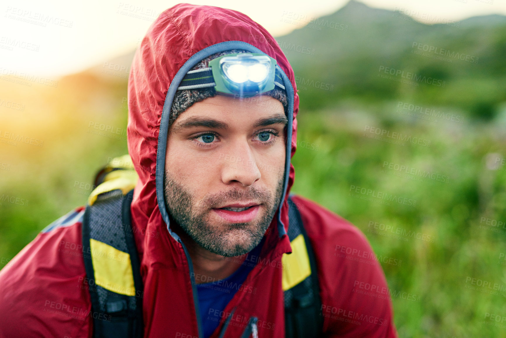Buy stock photo Cropped shot of a handsome young male athlete out for a morning run