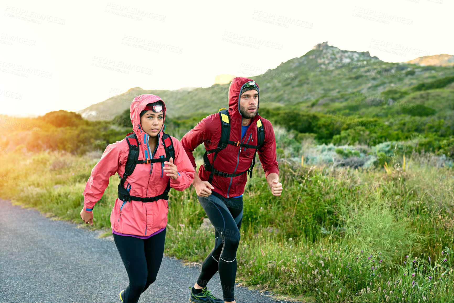 Buy stock photo Cropped shot of a young couple out for a morning run