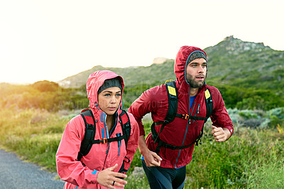 Buy stock photo Cropped shot of a young couple out for a morning run