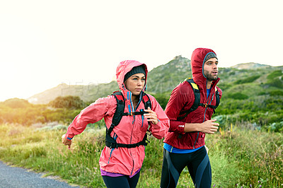 Buy stock photo Cropped shot of a young couple out for a morning run