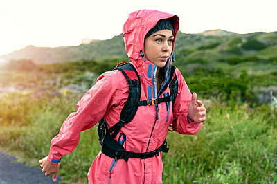 Buy stock photo Cropped shot of an attractive young female athlete out for a morning run