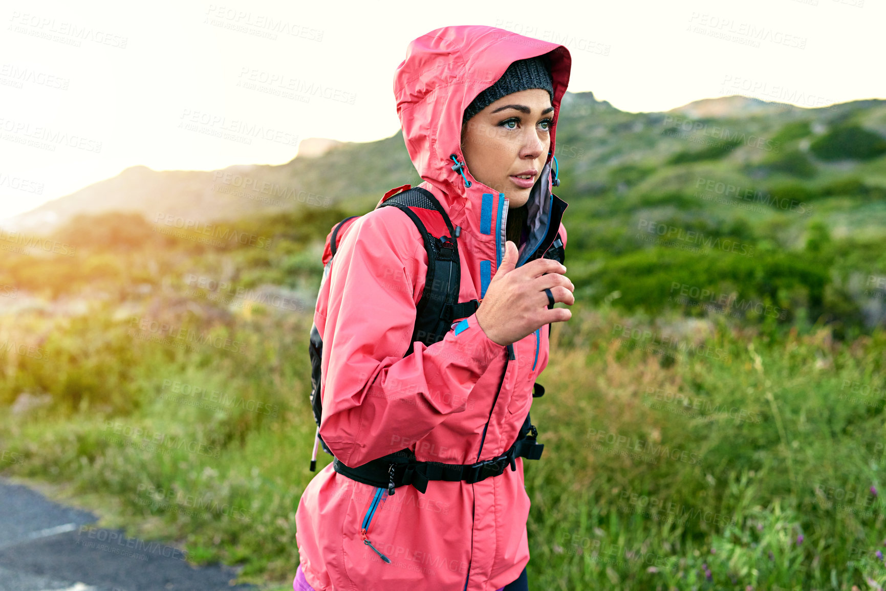 Buy stock photo Cropped shot of an attractive young female athlete out for a morning run