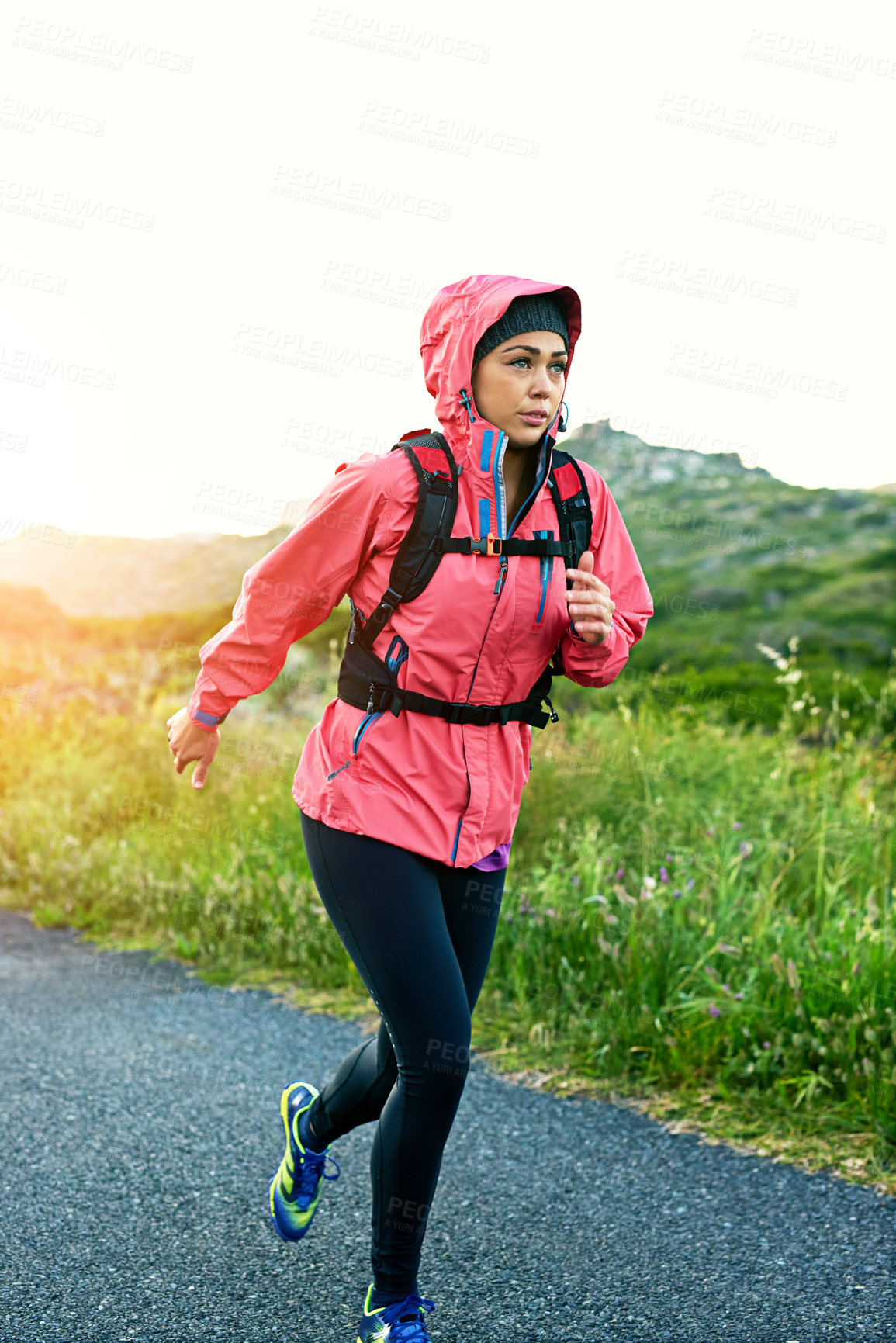 Buy stock photo Cropped shot of an attractive young female athlete out for a morning run