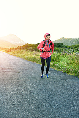 Buy stock photo Full length shot of an attractive young female athlete out for a morning run