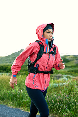 Buy stock photo Cropped shot of an attractive young female athlete out for a morning run