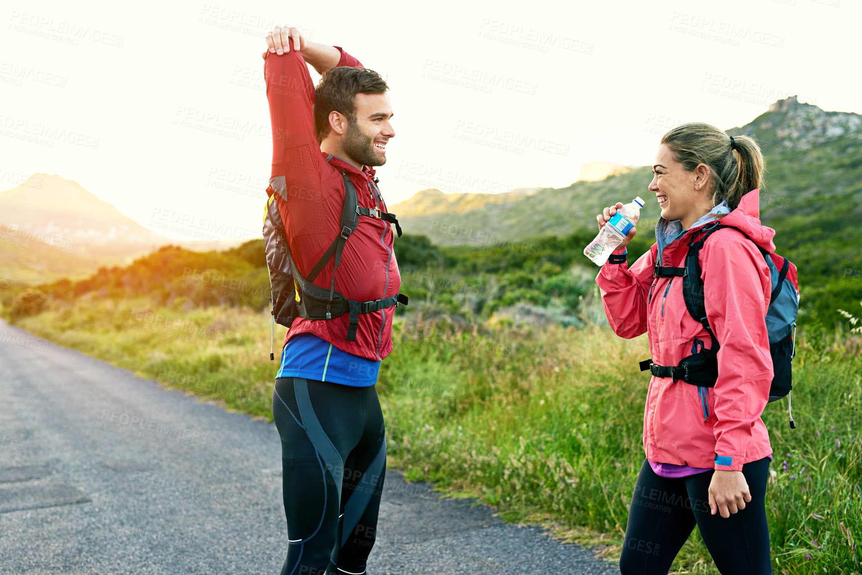 Buy stock photo Fitness, smile and stretching with couple in mountains for cardio training or workout preparation. Path, warm up and water with happy people in nature for start of exercise or wellness routine
