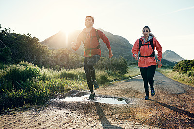 Buy stock photo Full length shot of a young couple out for a morning run