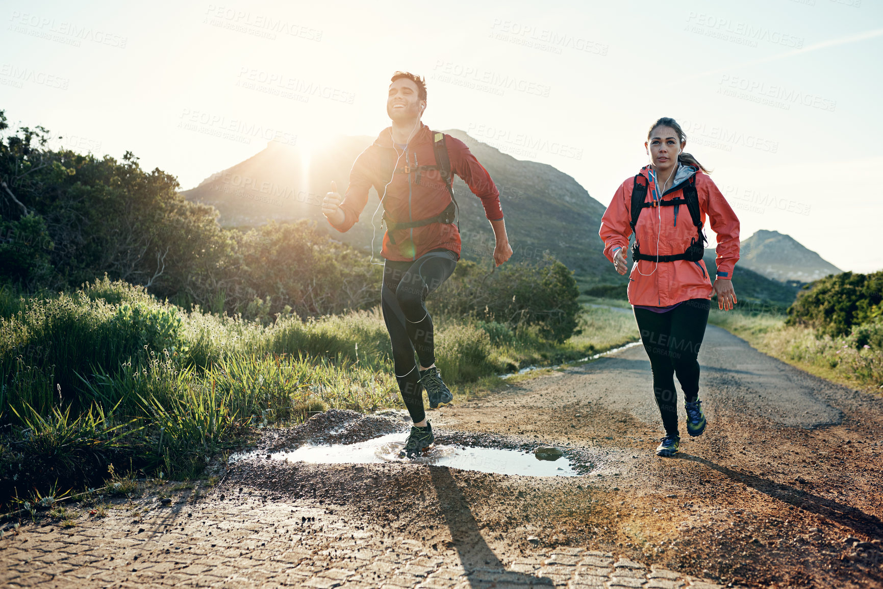Buy stock photo Full length shot of a young couple out for a morning run