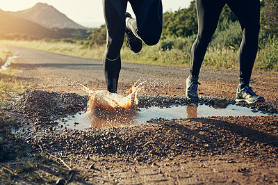 Buy stock photo Rearview shot of an unrecognizable young couple out for a morning run