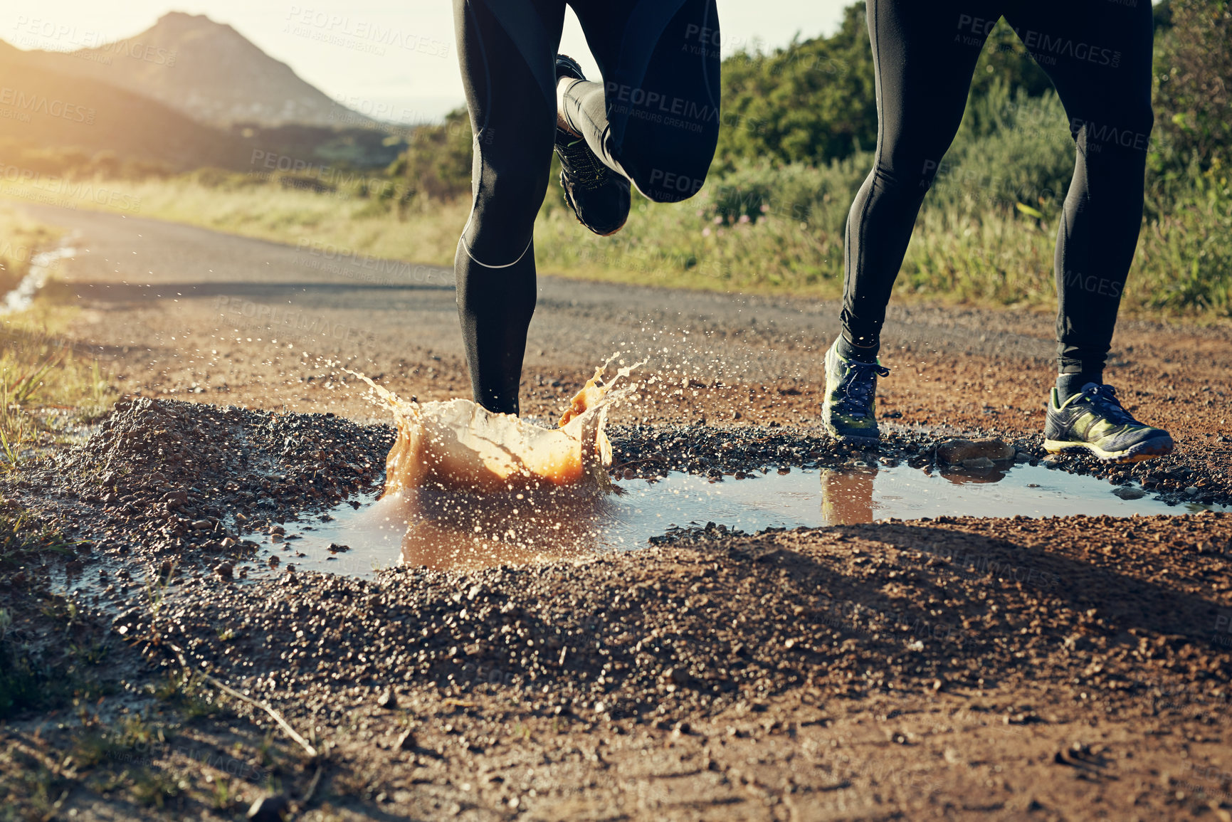 Buy stock photo Rearview shot of an unrecognizable young couple out for a morning run