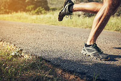 Buy stock photo Cropped shot of an unrecognizable young man out for his morning run