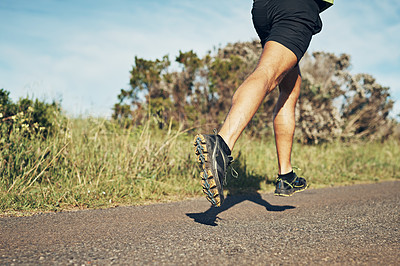 Buy stock photo Cropped shot of an unrecognizable young man out for his morning run