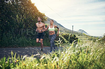 Buy stock photo Full length shot of a young couple out for their morning run