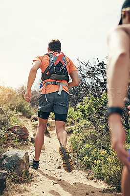 Buy stock photo Rearview shot of a young athletic couple out for their morning run