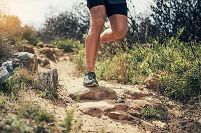 Buy stock photo Cropped shot of an unrecognizable young man out for his morning run