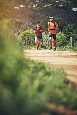 Buy stock photo Full length shot of a young athletic couple out for their morning run