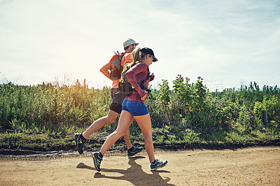 Buy stock photo Full length shot of a young athletic couple out for their morning run