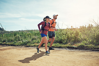 Buy stock photo Full length shot of a young athletic couple out for their morning run